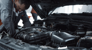 Mechanic performing financed auto repair service.