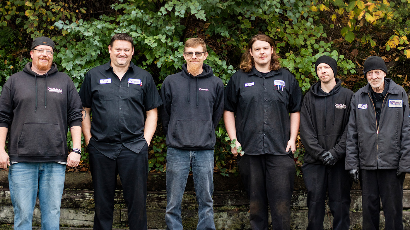 mcabes automotive trusted mechanics and technicians posing for a photo